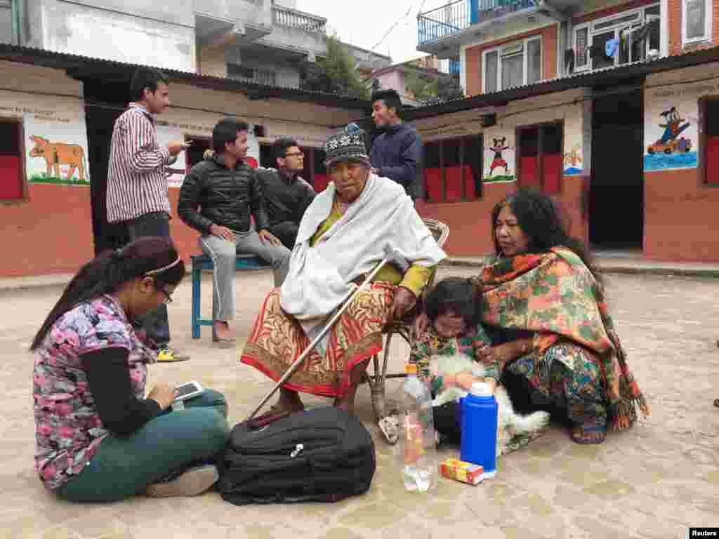 People take refuge at a school after a massive earthquake Kathmandu, Nepal, April 25, 2015.