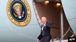 US President Joe Biden disembarks Air Force One at Boston Logan International Airport in Boston, Massachusetts, on December 5, 2023.