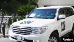 A U.N. vehicle carrying a team of United Nations chemical weapons experts leaves the hotel where they are staying in Damascus, August 28, 2013. 