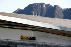 Germany's Christoph Hafer, Matthias Sommer, Lukas Frytz and Tobias Schneider in action during the Men's 4-man bobsleigh at the IBSF Bobsleigh International Sanctioned Race, Yanqing National Sliding Center, Yanqing, China, Oct. 26, 2021.