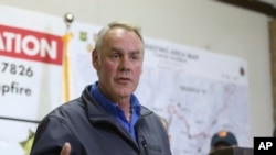 FILE - Ryan Zinke, U.S. interior secretary, responds to a reporter's question during a news conference after touring the fire-ravaged town of Paradise, Calif., Nov. 14, 2018.