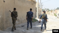 Syrian Democratic Forces patrol areas of Raqqa they controlled on Aug. 16, 2017. As IS was defeated, the people fled. Recaptured mid-October, the city is now nearly destroyed and entirely abandoned. (H. Murdock/VOA)