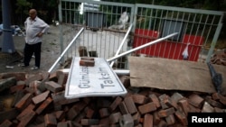 A man looks at a barricade set up by activists in Istanbul, Turkey on June 5, 2013.