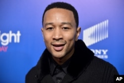 FILE - John Legend arrives at Pan African Film and Arts Festival premiere.