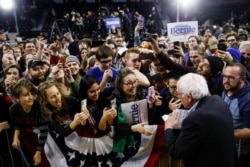 FILE - Democratic presidential candidate Sen. Bernie Sanders, I-Vt., meets with attendees campaign event, Thursday, Feb. 27, 2020, in Spartanburg, S.C.