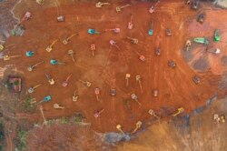 Excavators work at the construction site of a new hospital being built to treat patients from a deadly virus outbreak in Wuhan in China's central Hubei province, Jan. 24, 2020.