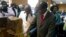 Zimbabwe's President Robert Mugabe cuts his birthday cake as he marks his 93rd birthday at his offices in Harare, Tuesday, Feb. 21, 2017. Mugabe described his wife Grace, an increasingly political figure, as "fireworks" in an interview marking his 93rd birthday.