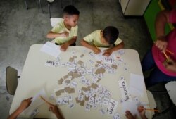 Children work during class at a school in Caracas, Venezuela, Oct. 7, 2019.