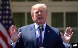 President Donald Trump speaks during an event on tax policy in the Rose Garden of the White House, April 12, 2018, in Washington.