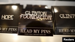FILE - A Clinton Foundation brooch is seen for sale at the Clinton Museum Store in Little Rock, Arkansas, U.S., April 27, 2015. 