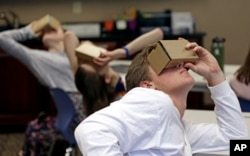 Zane Taylor and other students use virtual reality technology to learn about the D-Day invasion at Normandy during a history class at Crossroads FLEX High School in Cary, N.C., May 21, 2019.