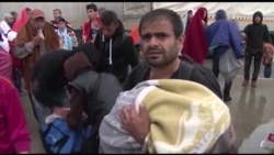 Refugees Arrive at Austrian Border; More on the Way