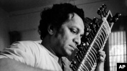 In this 1967 file photo, Ravi Shankar plays his sitar in Los Angeles, California.