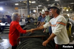 Democratic presidential candidate Hillary Clinton greets workers at Johnstown Wire Technologies in Johnstown, Pennsylvania, July 30, 2016.