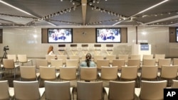 FILE - Two women are seen seated ahead of a technology panel in New York, Oct, 29, 2015. According to Accenture, a leader in technology services, today, only 20 percent of computer science degrees go to women.