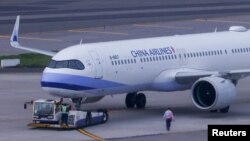 FILE - A China Airlines plane is seen at Taiwan Taoyuan International Airport in Taoyuan, Taiwan, April 12, 2023. 