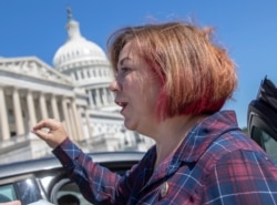 FILE - Rep. Linda Sanchez, D- Calif., pauses for a reporter's question on Capitol Hill in Washington, July 18, 2018.