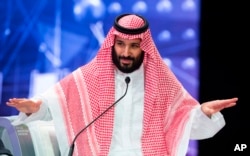 In this photo released by Saudi Press Agency, SPA, Saudi Crown Prince, Mohammed bin Salman addresses the Future Investment Initiative conference, in Riyadh, Saudi Arabia, Oct. 24, 2018.