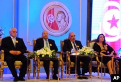 FILE - Left to right, Tunisian Nobel Peace Prize Winners Houcine Abassi, Abdessattar Ben Moussa, Fadhel Mafoudh and Wided Bouchamaoui are seen at a ceremony in Tunis, Nov. 9, 2015.