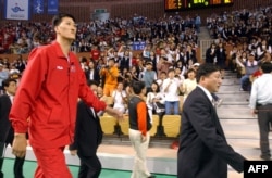 North Korean basketball player Ri Myoung-Hun is cheered by the crowd in South Korea in Sept. 2002 at the 14th Asian Games.