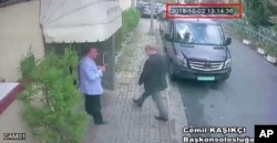 FILE - This image taken from CCTV video obtained by the Turkish newspaper Hurriyet and made available on Oct. 9, 2018, claims to show Saudi journalist Jamal Khashoggi entering the Saudi Consulate in Istanbul, Oct. 2, 2018.