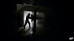 FILE - The second of two blast doors is opened, leading to the underground control room at an ICBM launch control facility near Minot, N.D., which staffed around the clock, June 24, 2014.