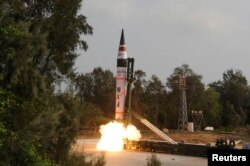 FILE - A surface-to-surface Agni V missile is launched from the Wheeler Island off the eastern Indian state of Odisha, April 19, 2012.