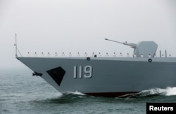 FILE - The Chinese navy’s guided missile destroyer Guiyang takes part in a naval parade off the eastern port city of Qingdao, April 23, 2019.