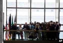 Senate Foreign Relations Committee member Sen. Ben Cardin, D-Md, left, speaks with the news media after meeting with Secretary of State-designate Rex Tillerson in Washington, Jan. 4, 2017.
