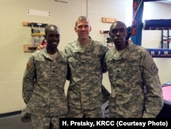 Soldiers and 2016 track and field Olympians, from left, Spc. Shadrack Kipchirchir, Staff Sgt. John Nunn and Spc. Paul Chelimo pose in Fort Carson’s boxing training room, nicknamed “The House of Pain.”