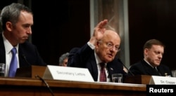 FILE - Director of National Intelligence James Clapper testifies before a Senate Armed Services Committee hearing on foreign cyber threats, on Capitol Hill in Washington, Jan. 5, 2017.