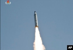 FILE - An image made from video of a news bulletin aired by North Korea's KRT on May 22, 2017, shows what was said to be the test-launch of a Pukguksong-2 missile at an undisclosed location in North Korea.