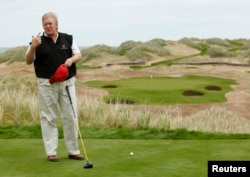 FILE - Donald Trump stands at the 13th tee of his Trump International Golf Links course on the Menie Estate near Aberdeen, north east Scotland, June 20, 2011.