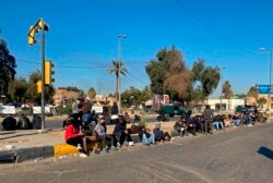 Protesters denouncing election results gather outside the heavily fortified Green Zone, in Baghdad, Iraq, Dec. 27, 2021.