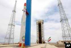 This photo, released by the official website of the Iranian Defense Ministry, July 27, 2017, claims to show the Simorgh satellite-carrying rocket at Imam Khomeini National Space Center in an undisclosed location in Iran.