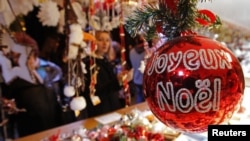 Christmas tree decorations are sold at the Christkindelsmaerik near Strasbourg Cathedral, Nov. 2012.
