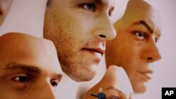 Phil Schiller, Apple's senior vice president of worldwide marketing, announces features of the new iPhone X at the Steve Jobs Theater on the new Apple campus on Tuesday, Sept. 12, 2017, in Cupertino, Calif. (AP Photo/Marcio Jose Sanchez)