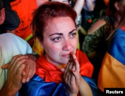A supporter of Armenian opposition leader Nikol Pashinyan reacts, after his bid to be interim prime minister was blocked by the parliament, during a rally in central Yerevan, Armenia, May 1, 2018.