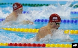 Britain's Adam Peaty goes on to break the world record in a heat of the men's 100-meter breaststroke during the swimming competitions at the 2016 Summer Olympics, in Rio de Janeiro, Brazil, Aug. 6, 2016.