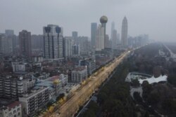 Suasana kawasan permukiman dan gedung-gedung perkantoran di Wuhan, di Provinsi Hubei yang terpantau melalui udara di tengah merebaknya wabah virus corona, Wuhan, China, 27 Januari 2020.