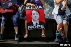 People take part in a protest against Supreme Court nominee Brett Kavanaugh, in front of the New York County Supreme Court at Foley Square in New York City, Aug. 26, 2018.