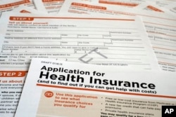 FILE - A draft copy of the 21-page of a Health and Human Services Department form proposed for use to apply for low-cost insurance from Medicaid or the Children's Health Insurance Program is photographed in Washington, March 12, 2013.