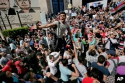 FILE - Egyptians shout slogans against Egyptian President Abdel-Fattah el-Sissi during a protest against the decision to hand over control of two strategic Red Sea islands to Saudi Arabia, in Cairo, Egypt, April 15, 2016.