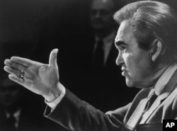 FILE - Four-term Alabama Gov. George Wallace in his office at the Capitol in Montgomery, March 26, 1984.