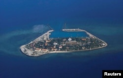 FILE - An aerial view of Southwest Cay, also known as Pugad Island, controlled by Vietnam and part of the Spratly Islands in the disputed South China Sea, April 21, 2017.