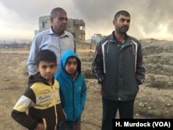 "Even our spit is dry and black," says one father who's family did not leave the area for Islamic State or the fires. "Life here is finished," he added, in Qayyarah, Iraq, Nov. 5, 2016.