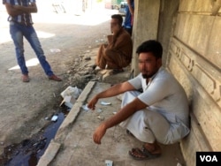 The IS resurgence in Tenek was unsuccessful at thwarting Iraqi forces movements in Mosul, but residents say they have no doubt more militants are hidden in their midst. Faces in this picture, taken in Mosul, Iraq, are blurred for security reasons, June 30, 2017. (H. Murdock/VOA)