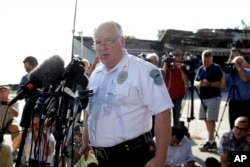 FILE - Ferguson Police Chief Thomas Jackson releases the name of the the officer accused of fatally shooting an unarmed black teenager Friday, Aug. 15, 2014.