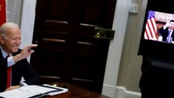 U.S. President Joe Biden waves to Chinese leader Xi Jinping as they begin a virtual meeting from the White House in Washington, U.S. Nov. 15, 2021.