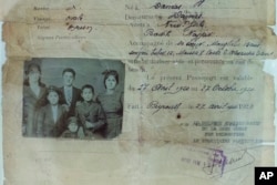 This picture taken Oct. 1, 2016, shows part of the Najjar family's passport. The Najjars were Syrian immigrants who came to the U.S. in 1920. Their passport is shown displayed at an exhibit at the Ellis Island National Museum of Immigration.